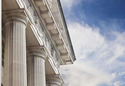 A close up look at a courthouse or government building with lots of copy space to the right