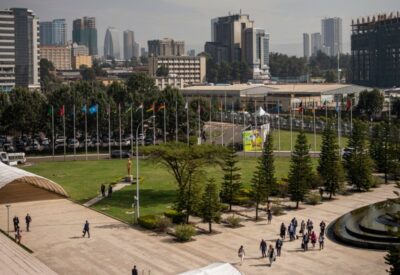 People walk towards the entrance of the African Union headquarters in Addis Ababa