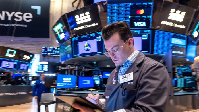 Trader on floor of the New York Stock Exchange